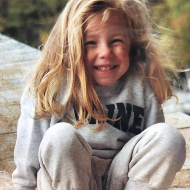 Annie cheesing as a kid