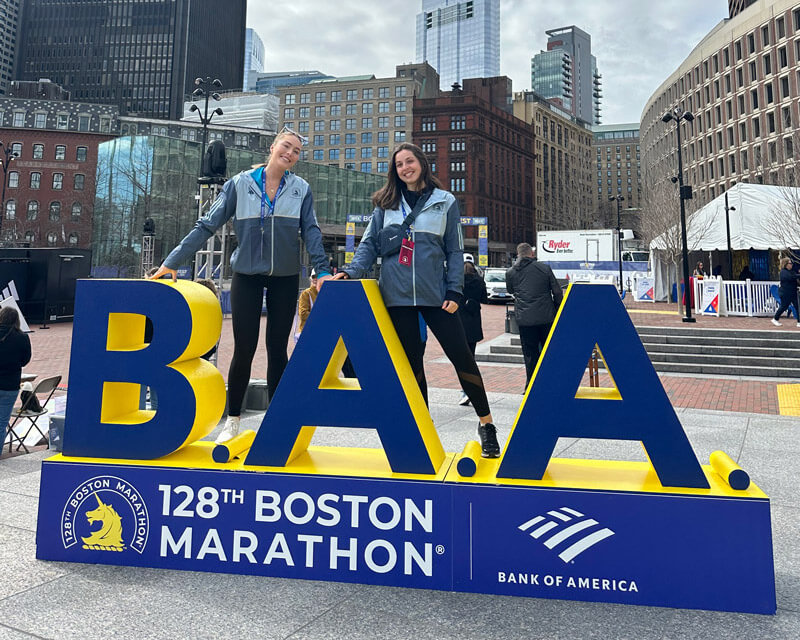 Posing with the B.A.A. Boston Marathon sign